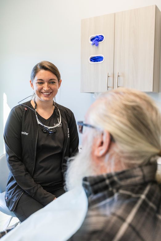 Jennifer Walker talking with Lake Bowen Dental Studio patient