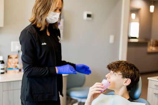 Patient receiving fluoride treatment at Lake Bowen Dental Studio