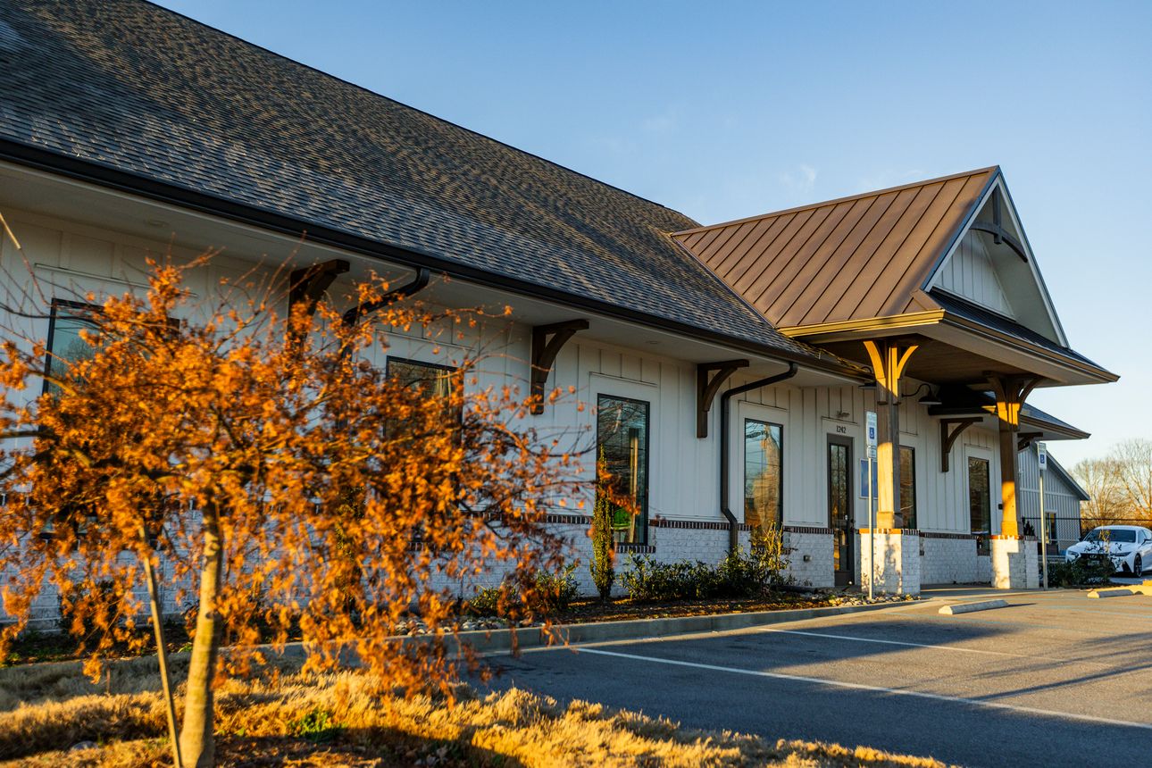 Exterior view of Lake Bowen Dental Studio building with modern architecture and parking area