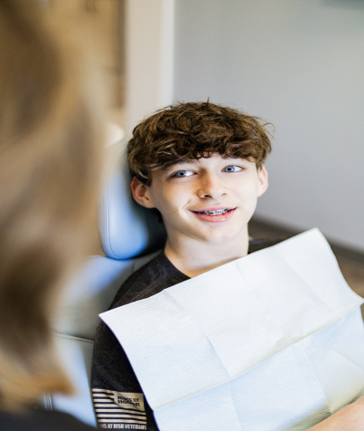happy dental patient smiling after implant restoration
